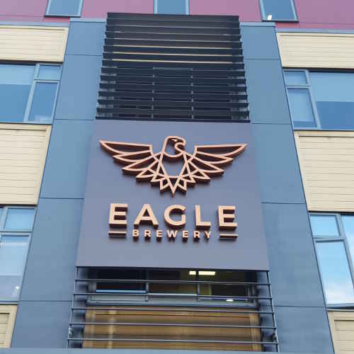 The Eagle logo clearly displayed on the building. Brewery